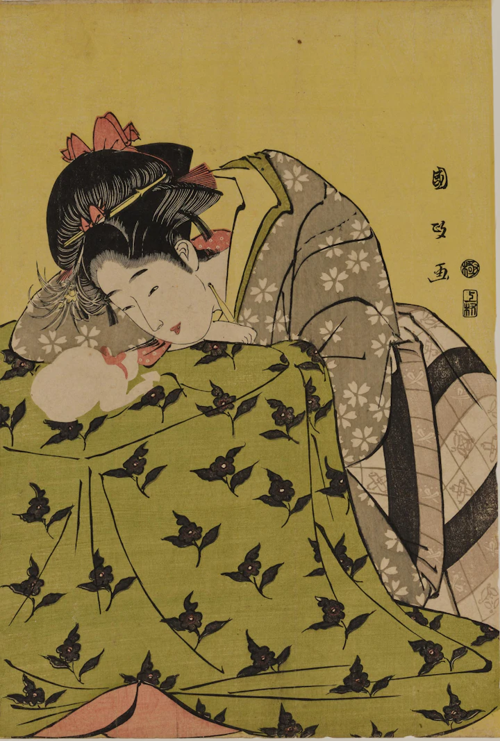 歌川国政の浮世絵「炬燵の娘と猫」。炬燵にもたれる娘と、炬燵の上で眠る白猫